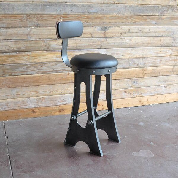 An industrial bar stool Black design with upholstered seat and back.